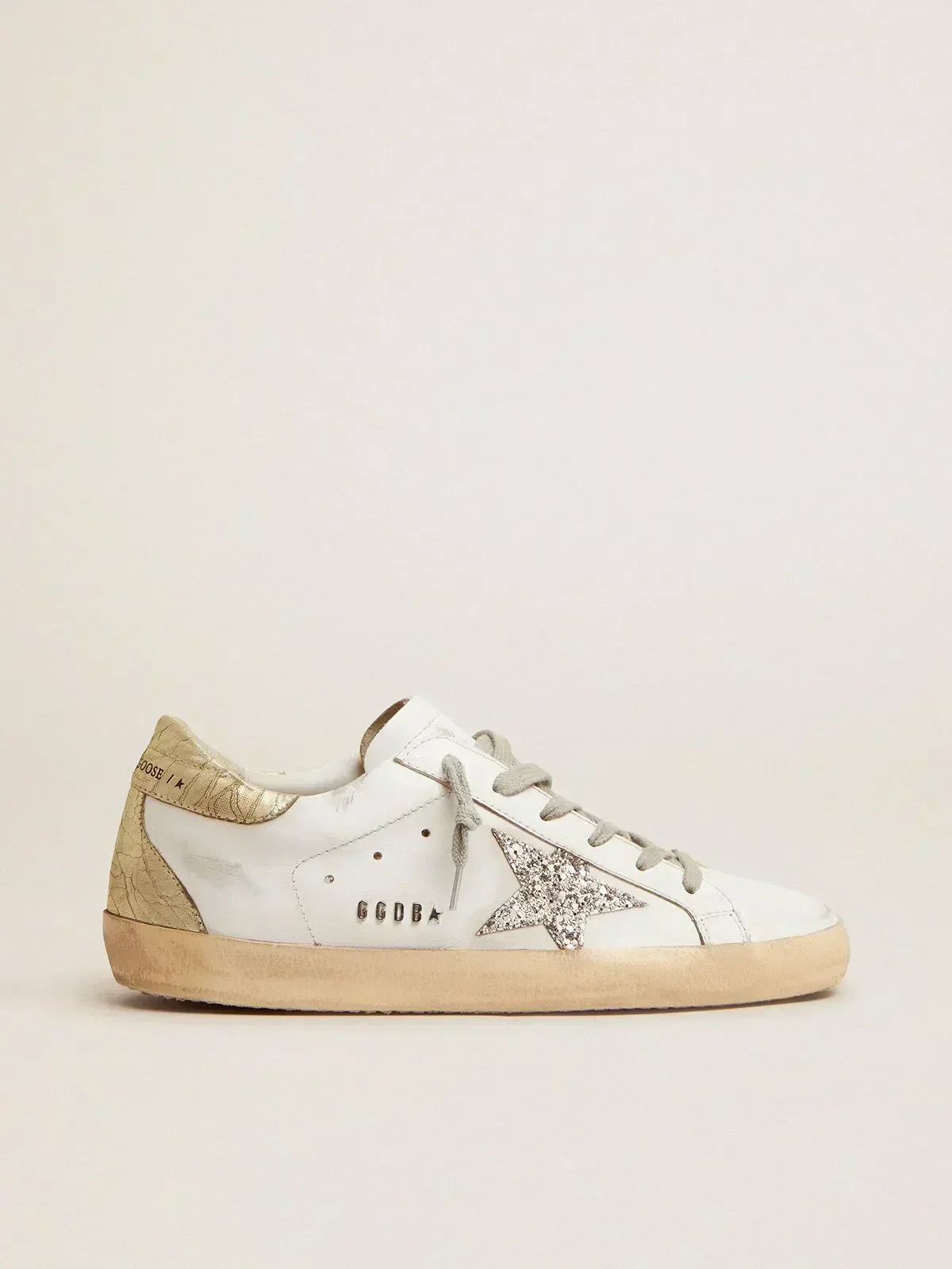 Super-Star sneakers with silver glitter star and glossy gold leather heel tab