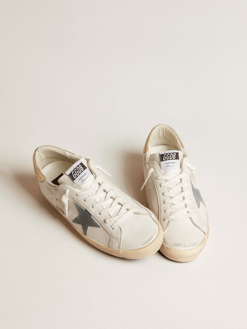 Super-Star with suede star and platinum snake-print leather heel tab